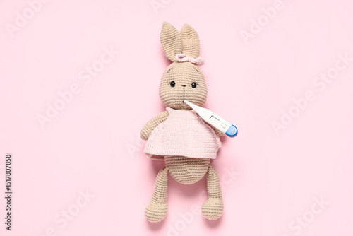 Toy rabbit with thermometer...