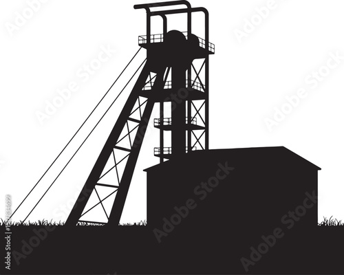 Silhouette of a mine headframe and building industrial landscape.