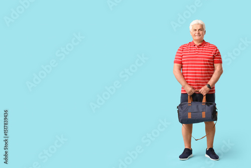 Senior man with sports bag ...