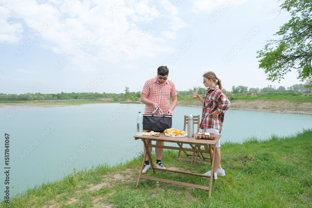 Fototapeta premium Family on picnic near the lake