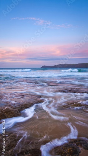 Serene coastal sunset ocean waves rockscape