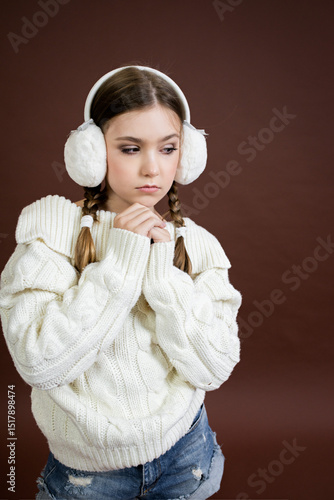 teenage girl in furry headphones model posing