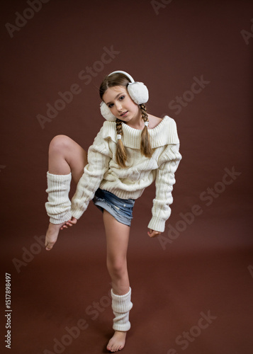 teenage girl in furry headphones model posing