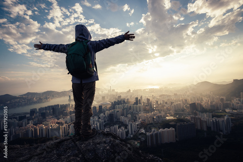 Canvas Print Successful backpacker enjoy the view stand on the cliff edge in hong kong