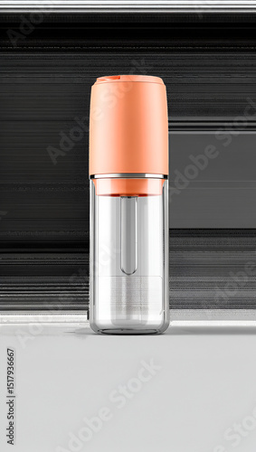 Clear bottle with orange cap isolated on white background, used for storing liquid, medicine, or cosmetics, with a dropper inside for easy application