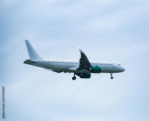 Airplane taking off against cloudy sky
