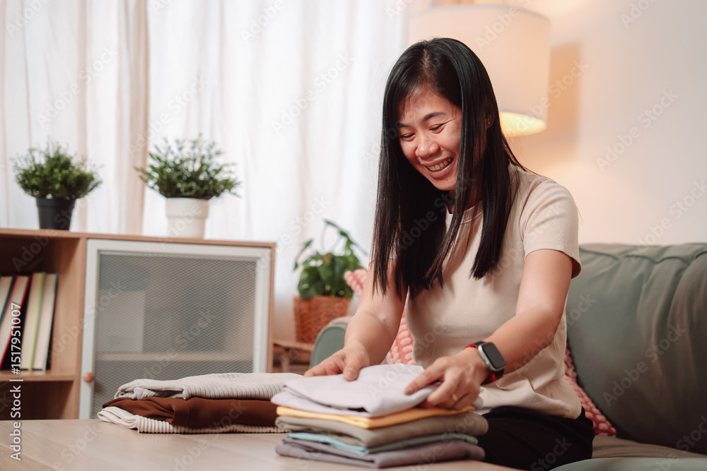 Woman Folded Stack Clothes Housework Female Laundry Lifestyle Housewife, Folding Freshly Washed Clothes into a Neat Stack, Embracing a Comfortable Domestic Life with a Smile at Home Woman Folded Stack Clothes Housework Female Laundry Lifestyle Housewife, Folding Freshly Washed Clothes into a Neat Stack, Embracing a Comfortable Domestic Life with a Smile at Home