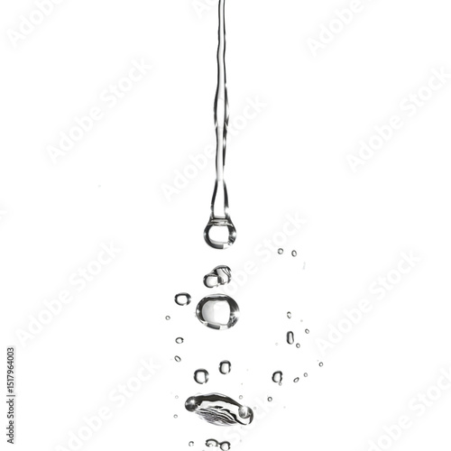 Water droplets cascading down in a graceful manner, capturing light reflections in a serene setting