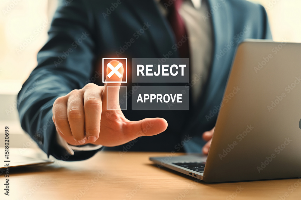 Fototapeta premium Business hand in gray suit pressing digital reject button above approve option at wooden desk with professional warm lighting