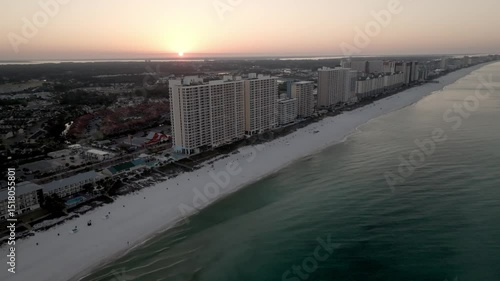 Wallpaper Mural Sunrise in Panama City Beach, Florida showing hotels and Gulf of America with drone video moving in a medium circle. Torontodigital.ca