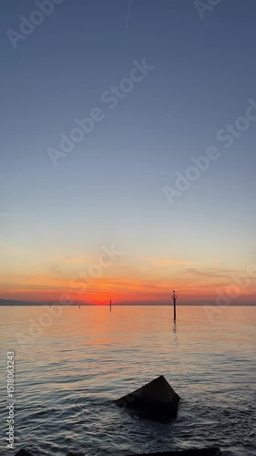 Early morning calm with gentle waves at Barceloneta Beach