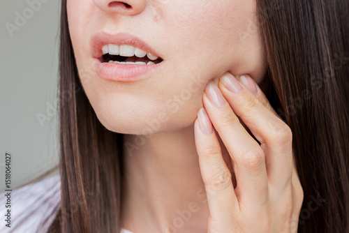 Young pretty caucasian woman suffering from gingivitis, gum inflammation, toothache. Dental care. Dentistry. Oral care