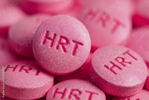pile of pink HRT pills close up, hormone replacement therapy for menopause symptoms