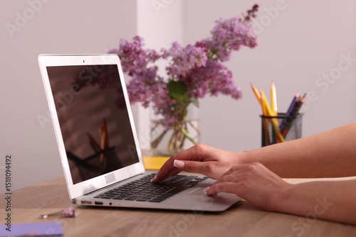 Wallpaper Mural Woman working on laptop at desk in home office, closeup Torontodigital.ca