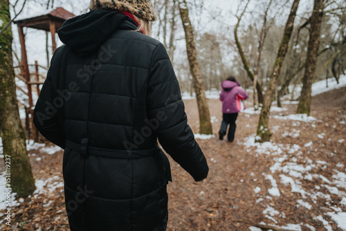 Wallpaper Mural Two friends strolling through a forest on a snowy winter day, enjoying the serene snowy scenery and outdoor freshness Torontodigital.ca
