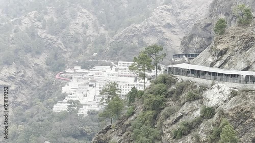 Cinematic footage capturing the spiritual journey and vibrant atmosphere of the Vaishno Devi pilgrimage in Katra, nestled in the scenic Trikuta Mountains of Jammu and Kashmir.