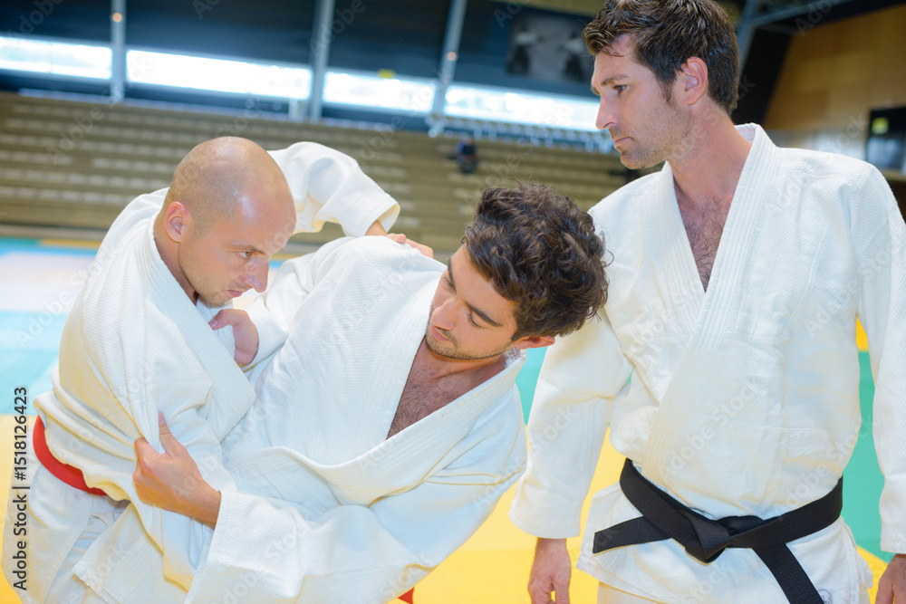 Fototapeta premium portrait of men and grappling match