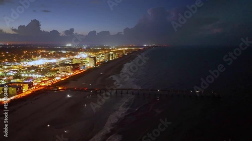 Aerial view of the Jacksonville Beach Pier in north Florida at night.