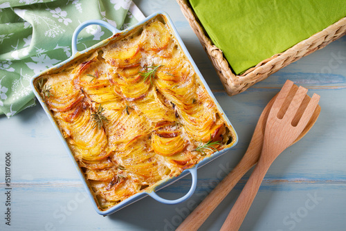 Tender creamy potato gratin. Scalloped potatoes or potato bake. High angle view