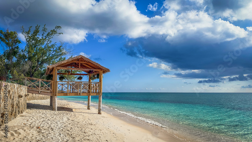 Tableau sur toile Wooden hut with suspended flower pots On Seven Mile Beach in the Caribbean, Gran