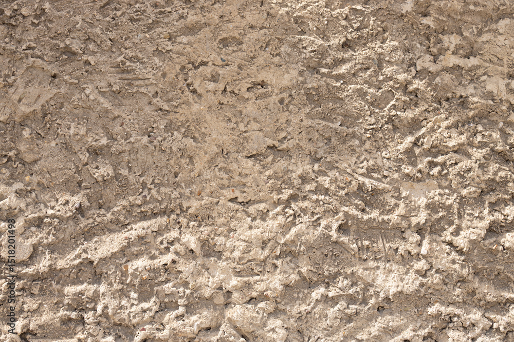 Rough textured beige plaster wall Rough textured beige plaster wall