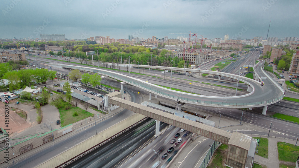 Fototapeta premium Traffic jams of roadside, transportation motion in a big city. Rush hour traffic on a city roads aerial timelapse.