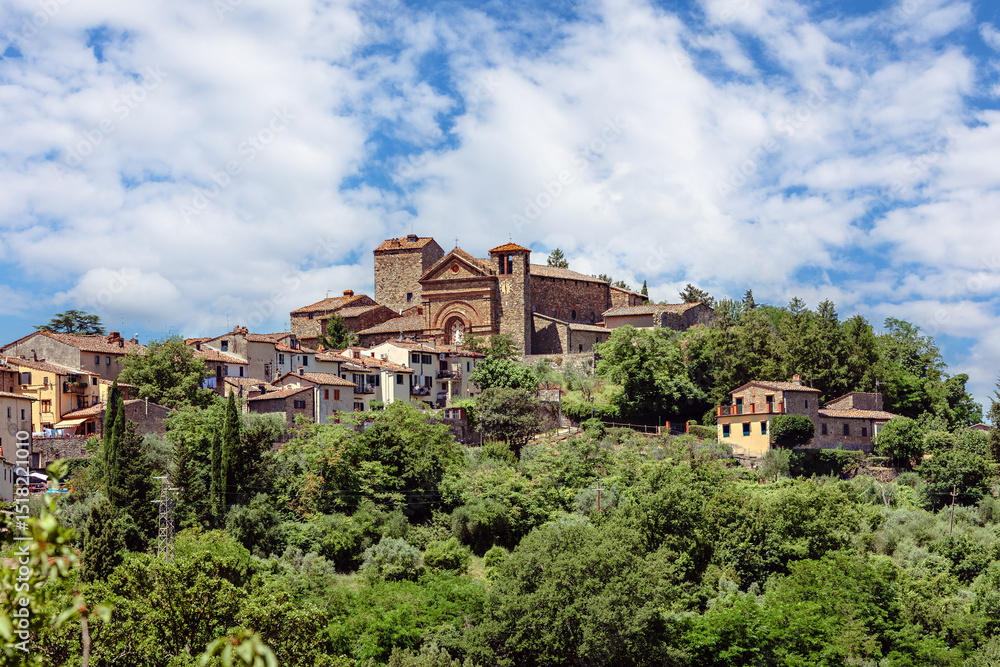 Obraz premium The medieval village of Montecatini Alto, located in the province of Pistoia in Italy, is nestled atop a hill and showcases its beautiful medieval architecture surrounded by lush greenery.
