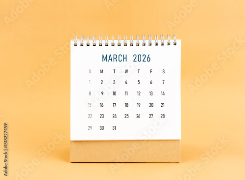 Wallpaper Mural March 2026 desk calendar on yellow background, Front view. Torontodigital.ca