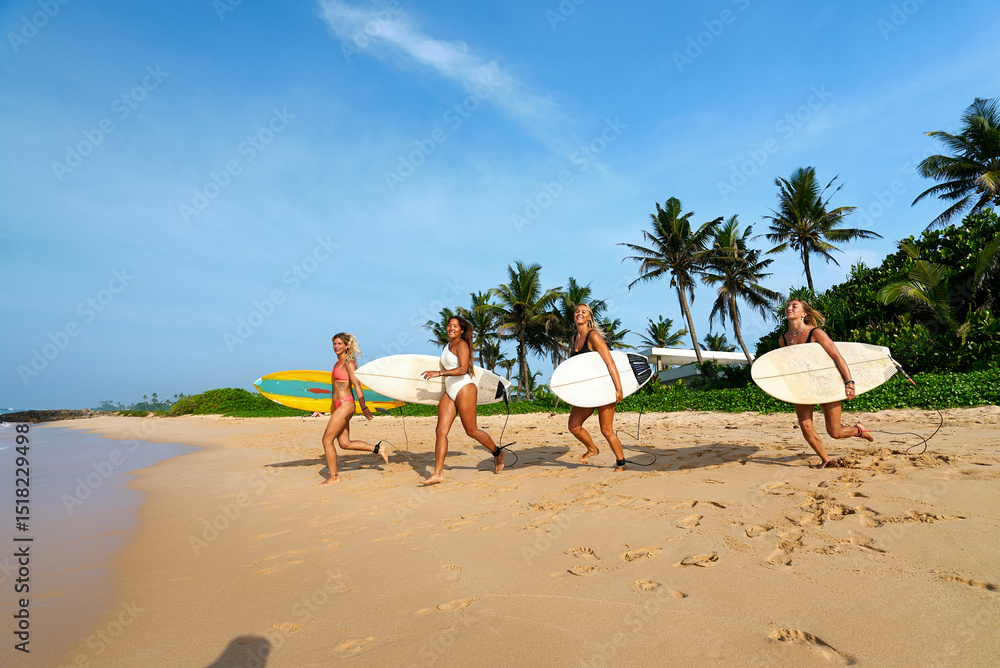custom made wallpaper toronto digitalFour diverse female surfers walk with surfboards on tropical beach. Friends enjoy sunny day, palm trees. Women athletes ready for ocean waves. Active lifestyle, summer adventure.