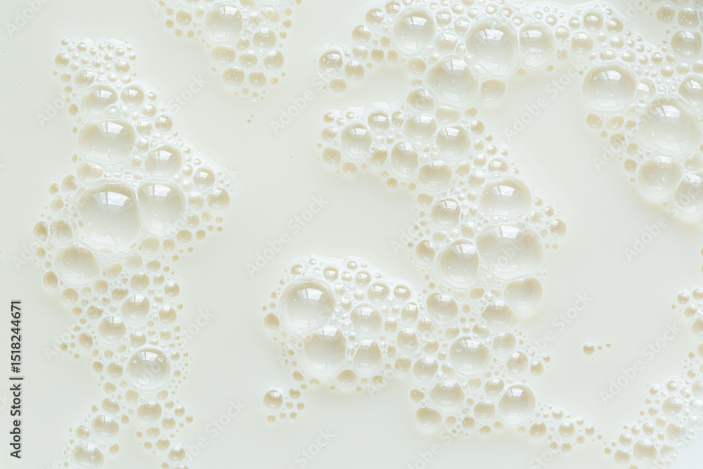 Macro milk surface close-up,Macro milk texture,White surface of milk and bubbles and ripples from above birds eye view