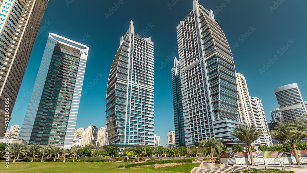 Residential buildings in Jumeirah Lake Towers timelapse hyperlapse in Dubai, UAE. Residential buildings in Jumeirah Lake Towers timelapse hyperlapse in Dubai, UAE.