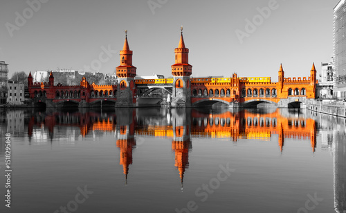 Photography Oberbaum Bbridge“ in Berlin is a popular landmark and iconic sight spanning over River Spree with arches, towers and gallery