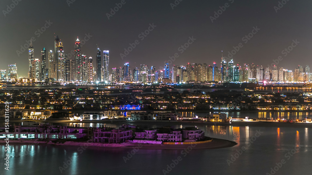 Fototapeta premium Jumeirah Palm island skyline night timelapse in Dubai, UAE.
