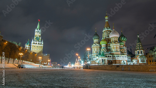 Moscow Kremlin timelapse hyperlapse with Spasskaya tower and Cathedral of St. Basil, Russia. Red Square in winter night