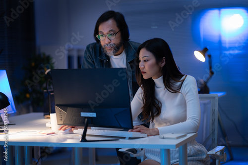 Photography group of Happy young asian business people chatting happily after a night of overtime work in the office