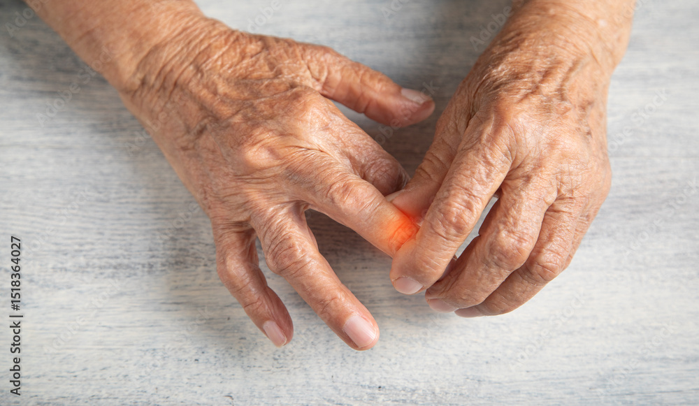 Fototapeta premium Caucasian elderly woman suffering from pain in hand.