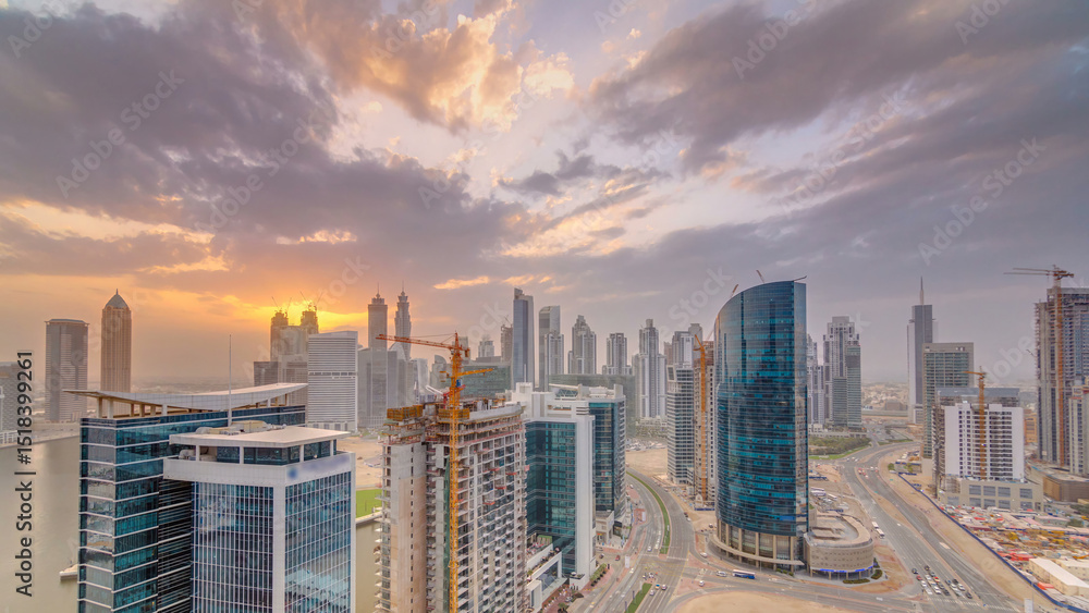 Obraz premium Dubai business bay towers at sunset aerial timelapse.