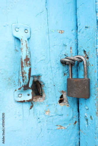old lock on a vintage blue door