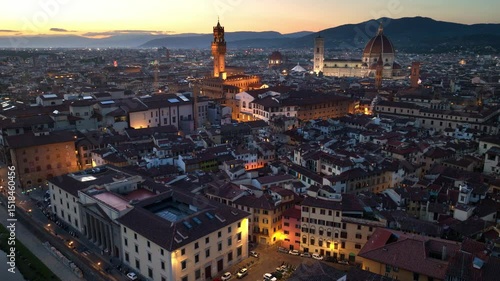 night aerial view of Florence with Florence cathedral and Ponte Vecchio, Italian Renaissance architecture, iconic drone shot of Florence