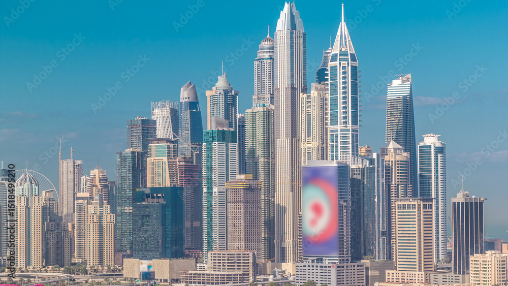 Obraz premium Dubai Marina skyscrapers and golf course morning timelapse, Dubai, United Arab Emirates