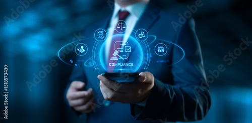 Businessman holding smartphone with compliance icons on screen - business and regulations concept