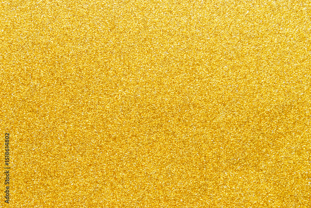 Golden sparkle glitter paper background close up Golden sparkle glitter paper background close up