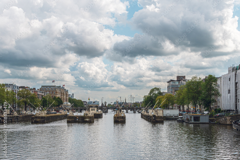 Naklejka premium Typical view of Amsterdam from its waterways