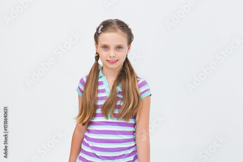Valokuva Girl standing in studio wearing pastel-clip side plaits and striped lavender min