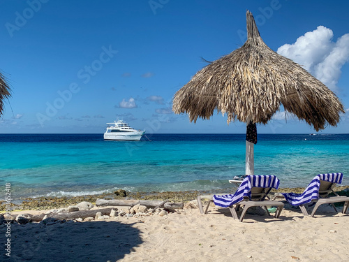 Private yacht floating off the shore of Klein Curaçao with white sand and turquoise water