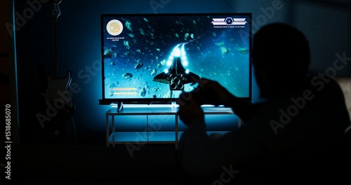 Papier peint Young adult having fun with video games on his smart tv setup, connecting his console on lcd monitor television in living room and enjoying chill game night at home