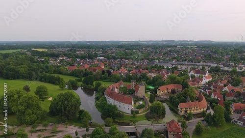 A panoramic drone view of the city and the castle, which sits on the water, in Steinfurt, Germany (Wasserschloss Burgsteinfurt)