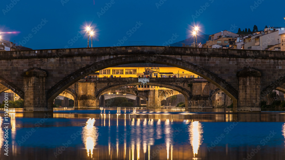 Naklejka premium Ponte Alla Carraia and Santa Trinita Holy Trinity Bridge day to night timelapse over River Arno in Florence