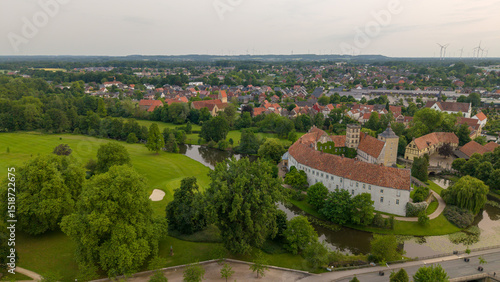 A panoramic drone view of the city and the castle, which sits on the water, in Steinfurt, Germany (Wasserschloss Burgsteinfurt)