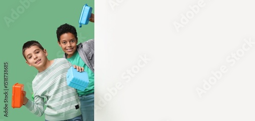 Cute boys with lunchboxes a...
